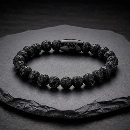 Frank 1976 Armband aus Lavastein auf Schieferplatte